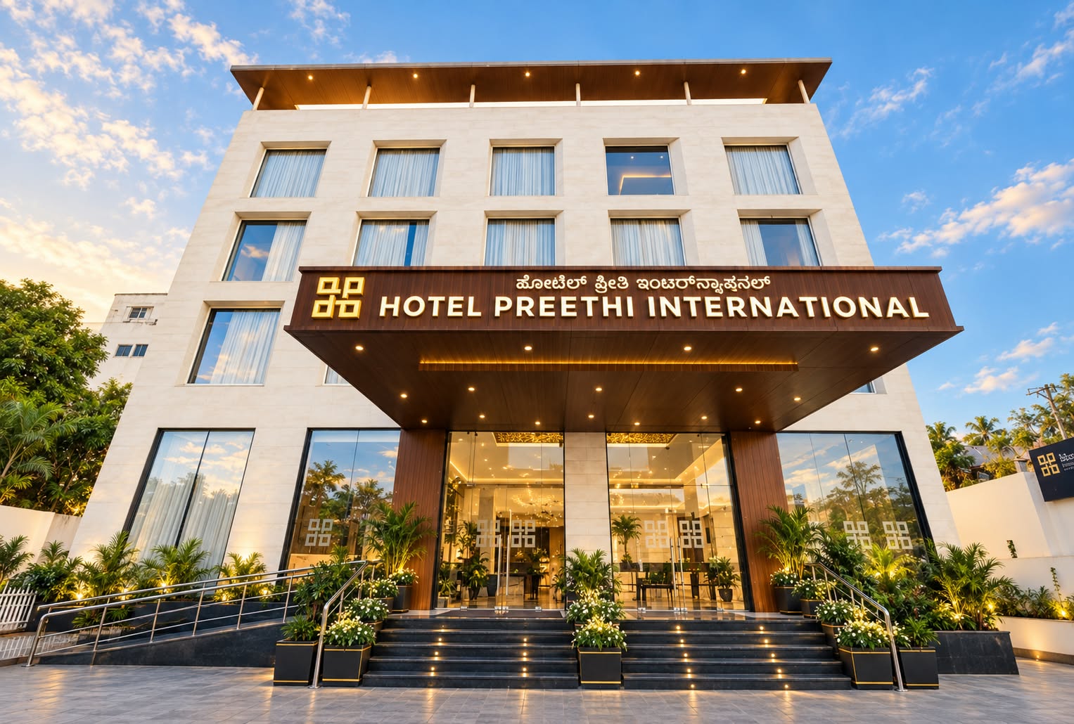 Front façade and entrance of Hotel Preethi International in Mysuru