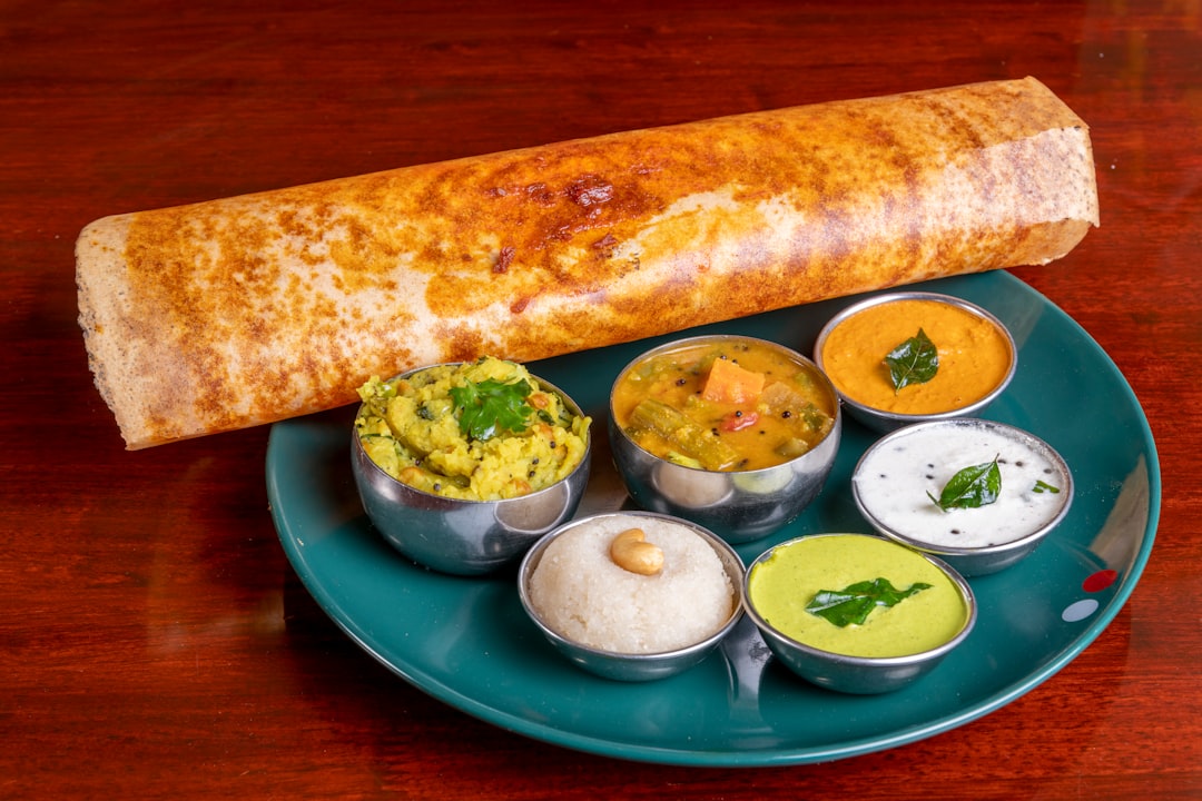 South Indian dosa served with chutneys and accompaniments
